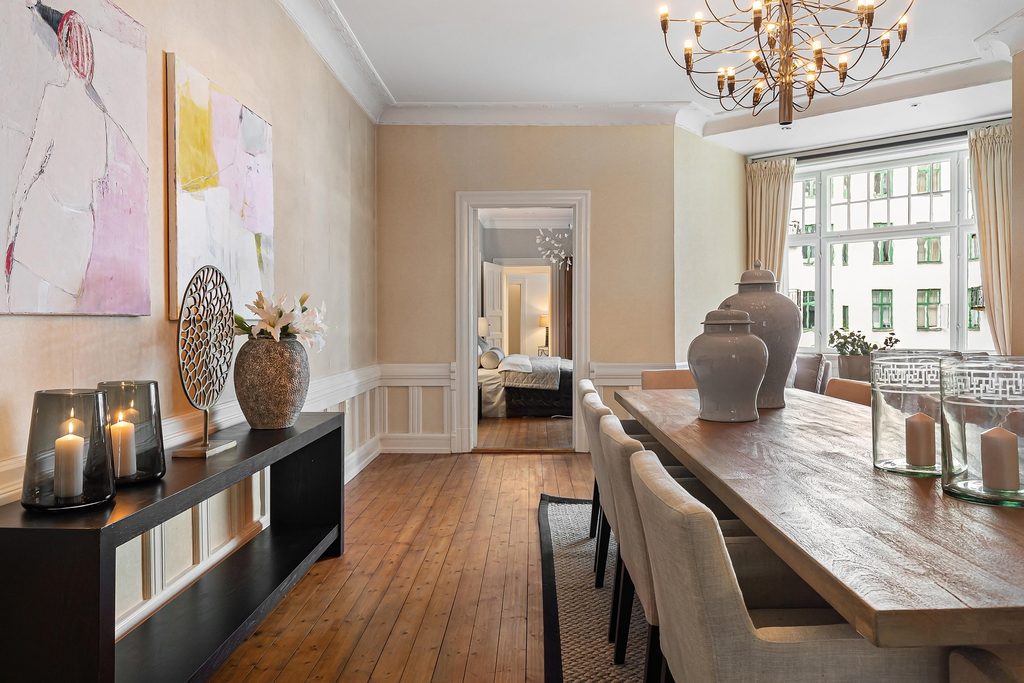 Elegant furnished interior with freshly painted neutral walls and white trim